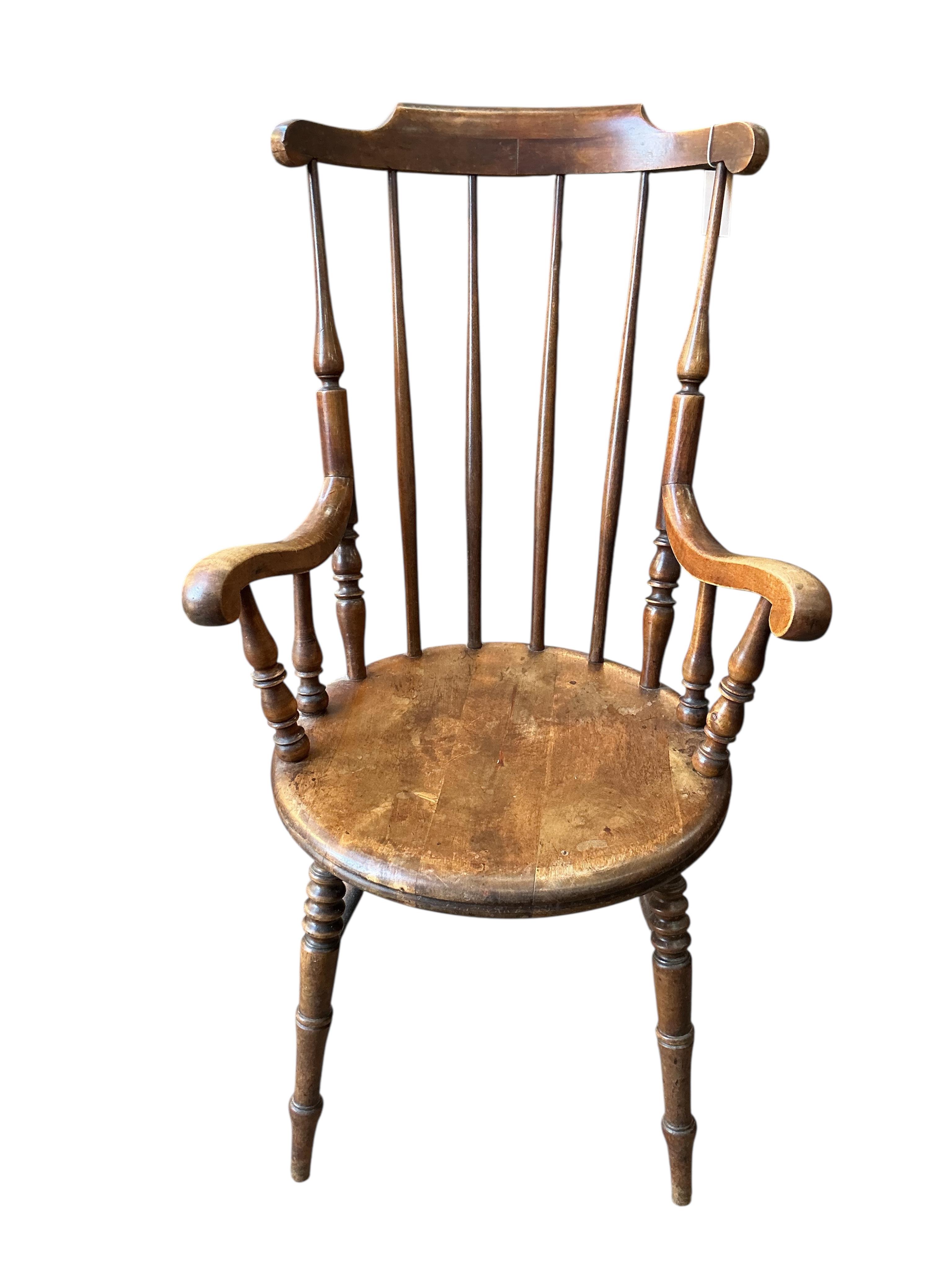 An early 20th century Windsor beech armchair, width 61cm, depth 52cm, height 110cm